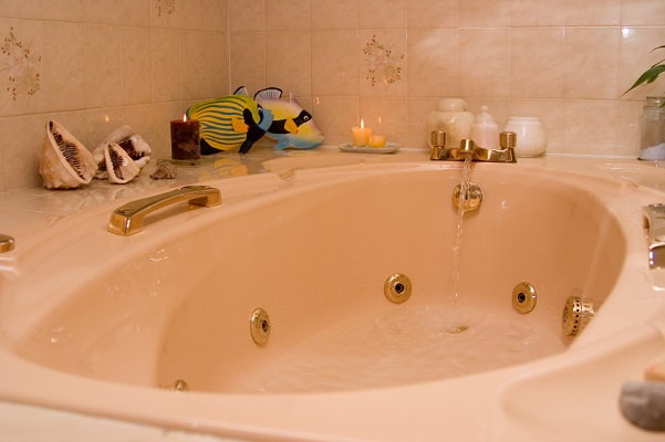 bathtub with seashells and fish decor