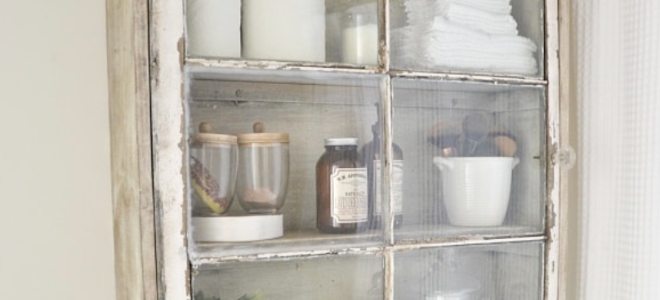 Upcyled bathroom shelf features old glass window