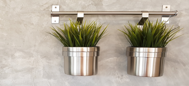 a concrete wall with stainless planters