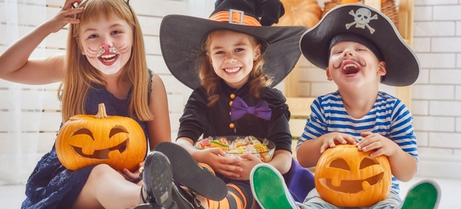 Kids with Halloween pumpkins.