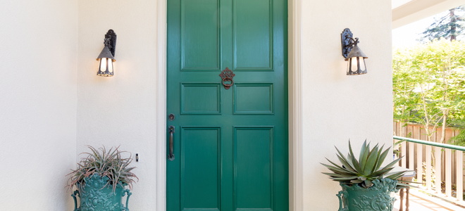 A front door with new lights on either side.