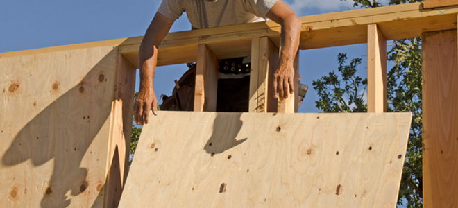 A piece of plywood going up on construction of a house. 