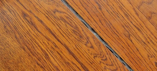 finished wood flooring with a sealed gap between planks