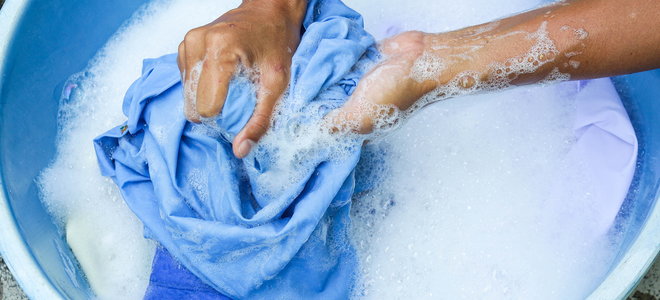 Washing fabric in a container