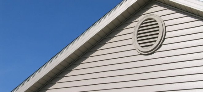 house with grey siding and soffit
