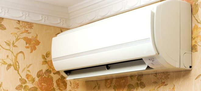 air conditioner mounted to a wall in the corner of a room