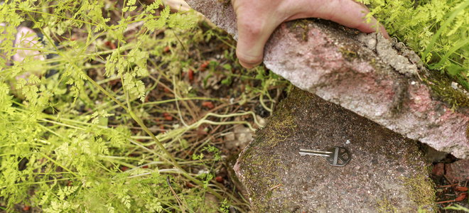 A hide a key under a rock.