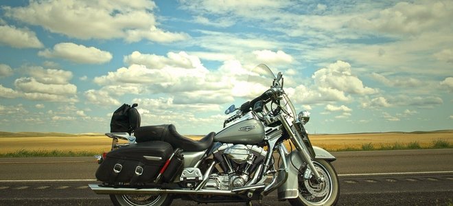 silver and black motorcycle against blue sky