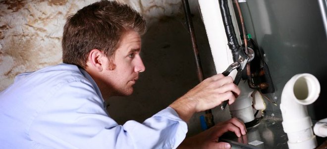 Man repairing a furnace