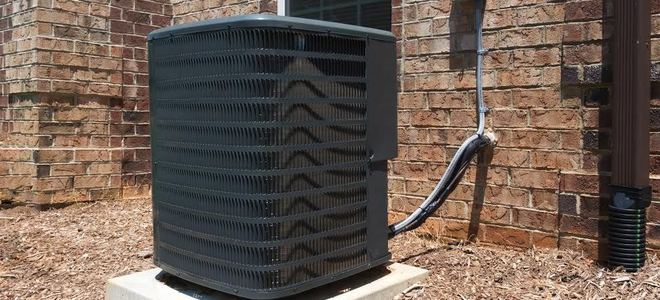 air conditioning unit on a pad outside