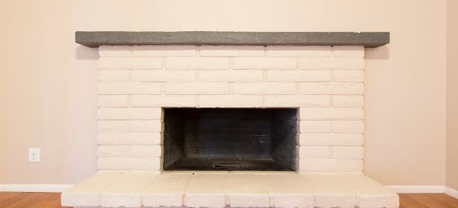 A white brick fireplace. 