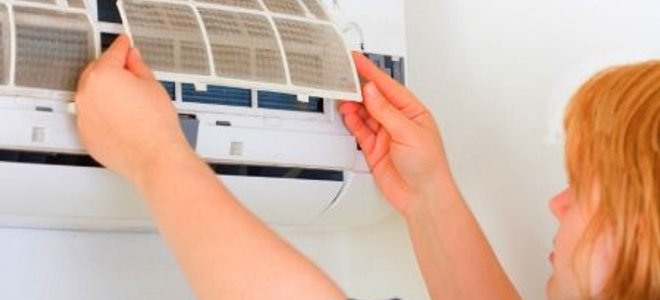 Removing the dust filter from the interior unit of a mini split heat pump.