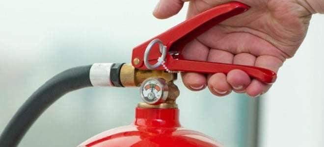 A fire extinguisher against a white background. 