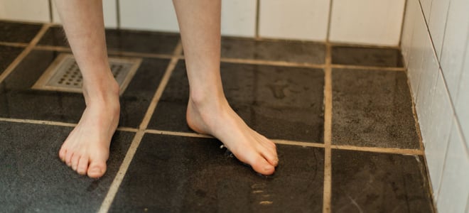 Black tile on a shower floor.