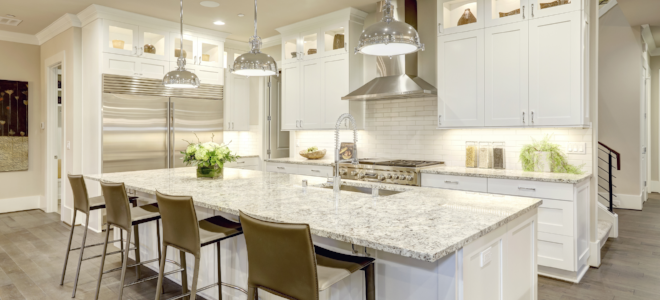 kitchen with white cabinets and marble countertops