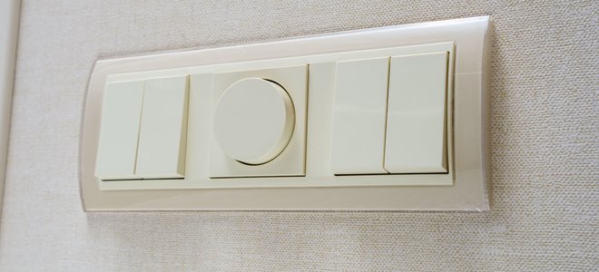 A dimmer switch and regular light switches.