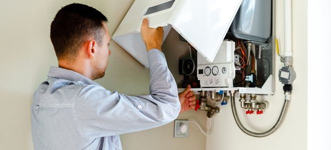 person repairing boiler device
