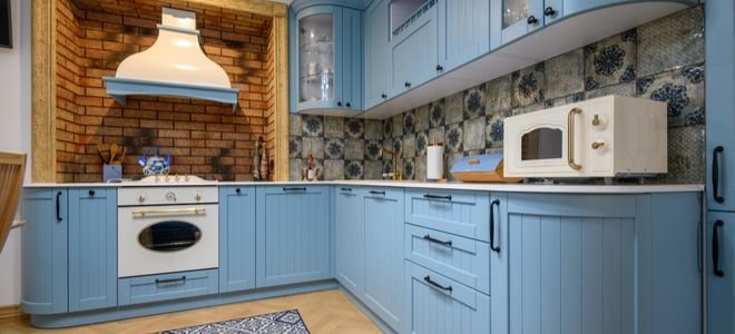 blue retro fridge in modern kitchen with houseplant