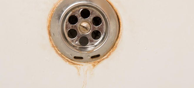 A rusty sink drain. 