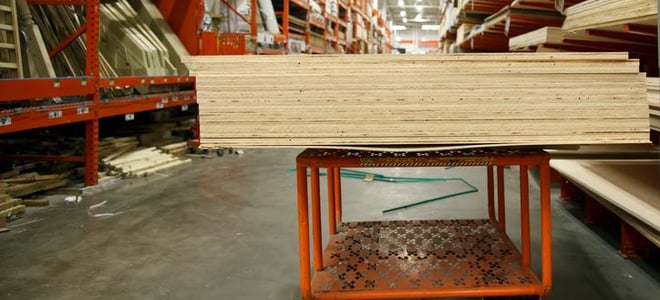 Planks of wood on a shopping cart at a home improvement store