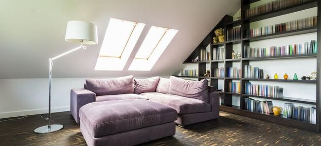 room with built in bookshelves and large couch