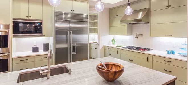 A modern kitchen with a quartz countertop. 