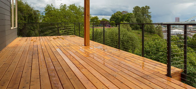 bright clean wood deck with railing and view