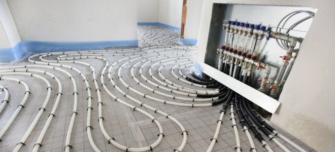 radiant heating pipes running throughout a room under construction