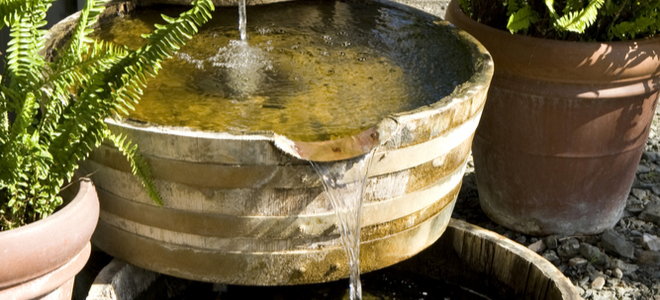 tiered fountain made from cut barrels