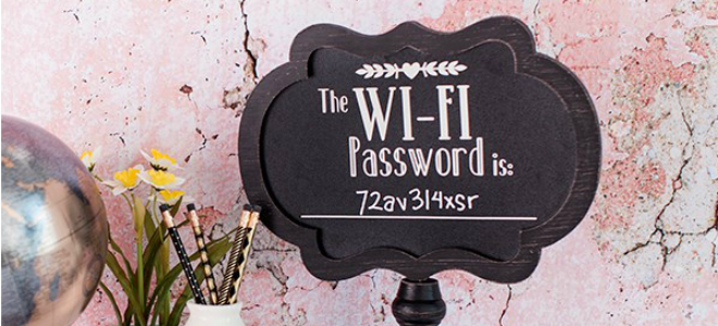 A chalkboard sign with a wi-fi password. 