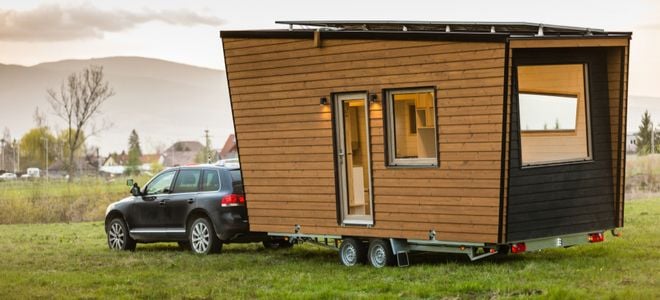 suv towing mobile tiny house