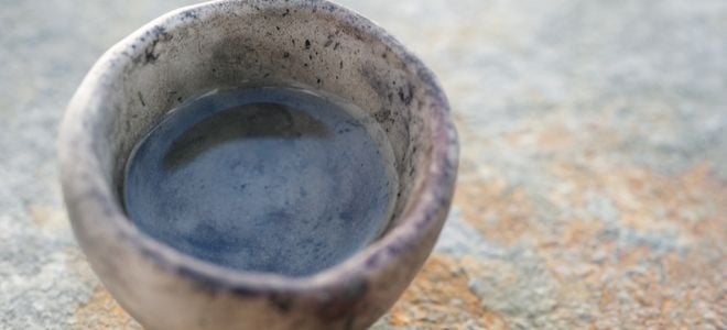 hand made clay mug with rough, wabi sabi design feel