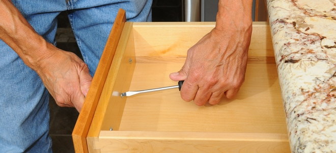 changing the hardware on a kitchen drawer