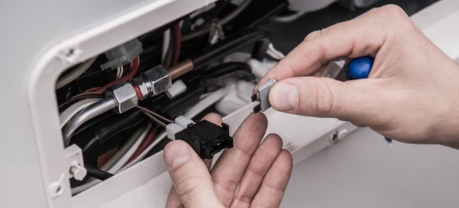 hands fixing RV fuse wiring