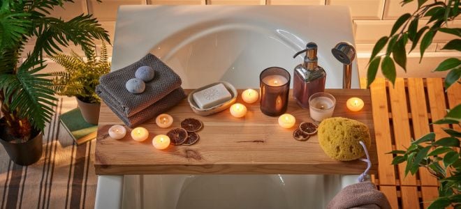candles on shelf over bath tub
