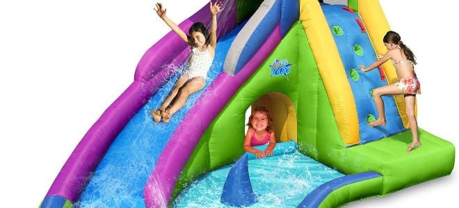 kids playing on an inflatable pool playground