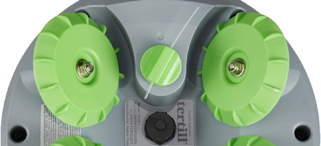 underside of a gray and green weeding robot
