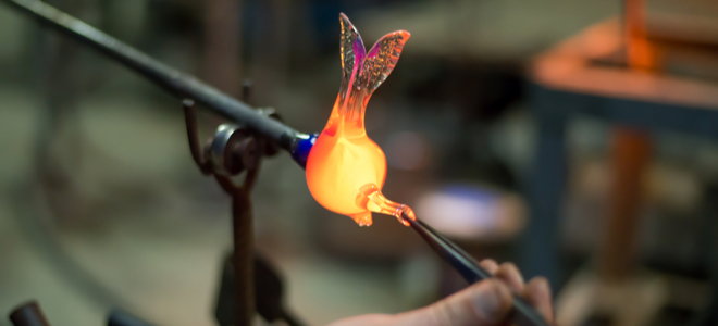 hand crafted glass art object under construction with delicate wings