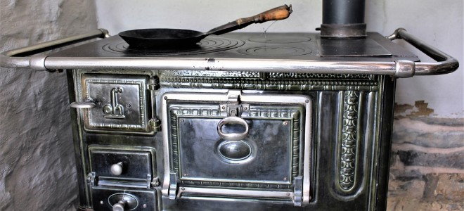 a wood stove with oven and cooking surface