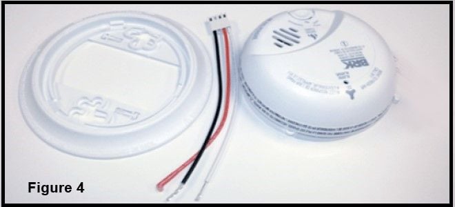 disassembled smoke detector with wiring