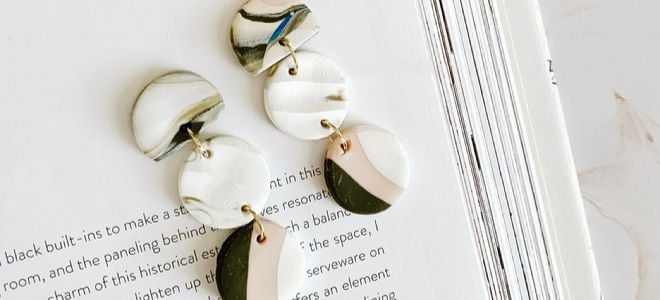 home made earrings on a book