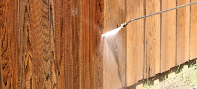 pressure spray cleaning fence