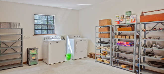 garage with laundry appliances and storage racks