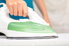 a white and green clothes iron