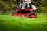 person using a riding lawn mower