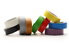 Many different colored rolls of electrical tape sit against a white background.