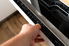 hand opening dishwasher door