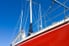 sailboat with a red hull