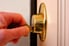 hand locking or unlocking lock with a key