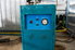 Teal-colored swamp cooler in a shop